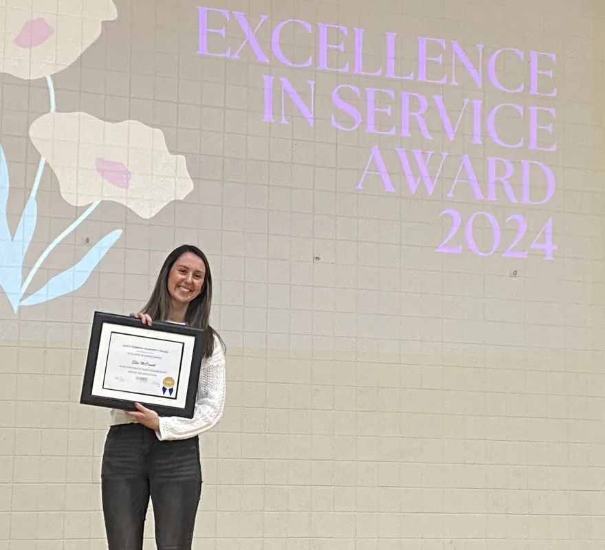 NHCC employee, Ellie McDowell with her Excellence award