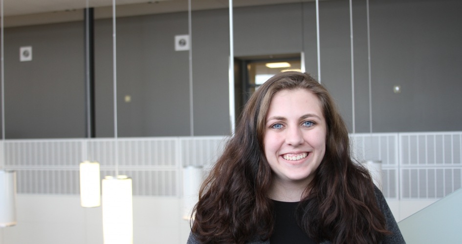 paralegal student Ali inside smiling at the camera