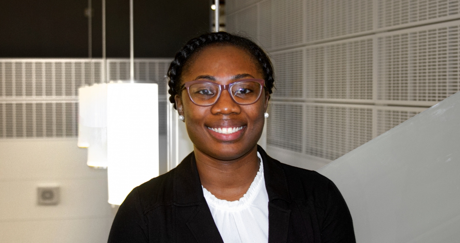 paralegal student Sehlone standing inside smiling at camera