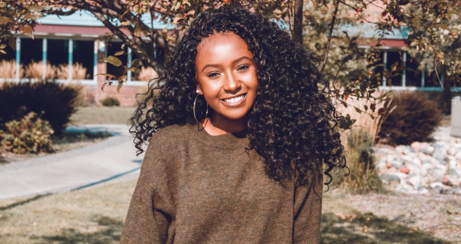 female student smiling outside