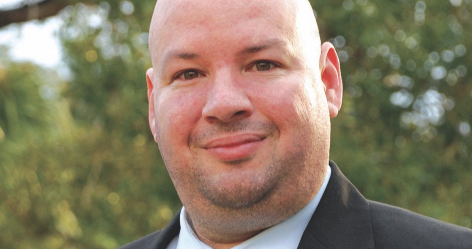 NHCC president Rolando Garcia standing outside smiling at the camera