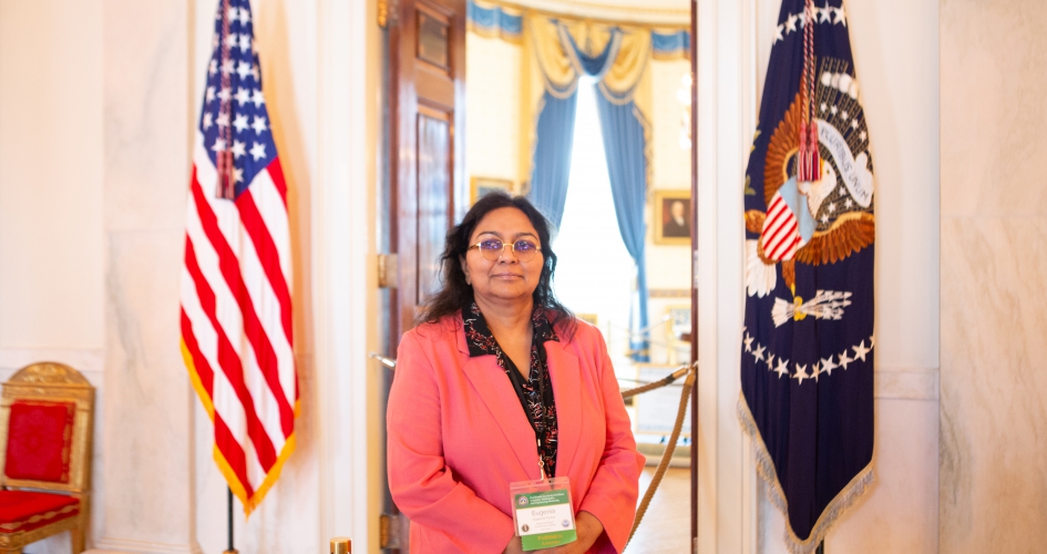 Dr. Eugenia Paulus standing inside white house