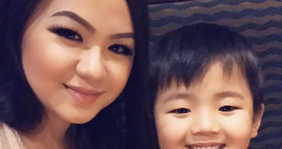 STEM Student Mee La Khang posing for a selfie with her son