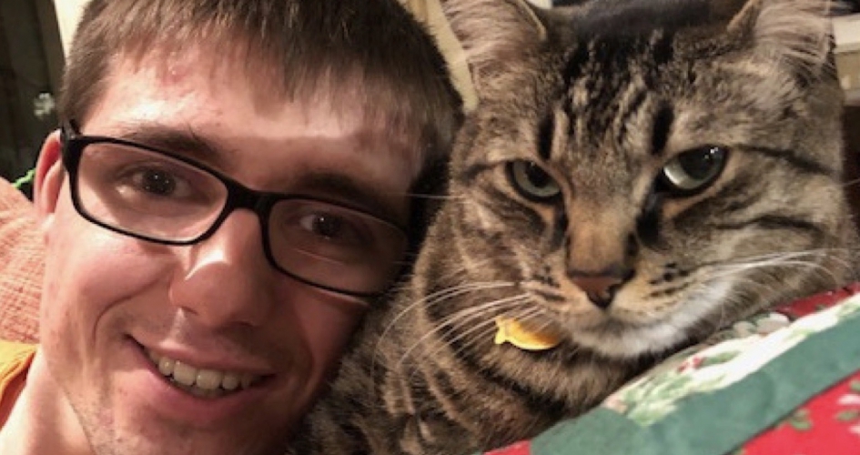 selfie of student Greg Wetzel with his cat
