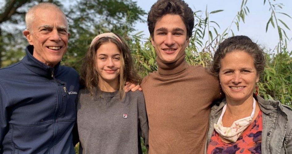 faculty member Patricia Diamond taking a picture with her daughter, son, and husband