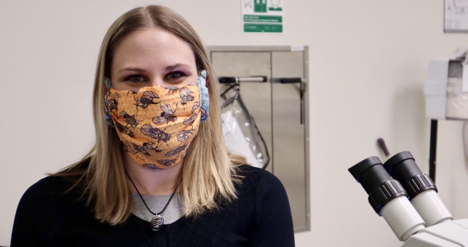 STEM student Melissa Sawyer pictured inside one of NHCC's labs with her mask on