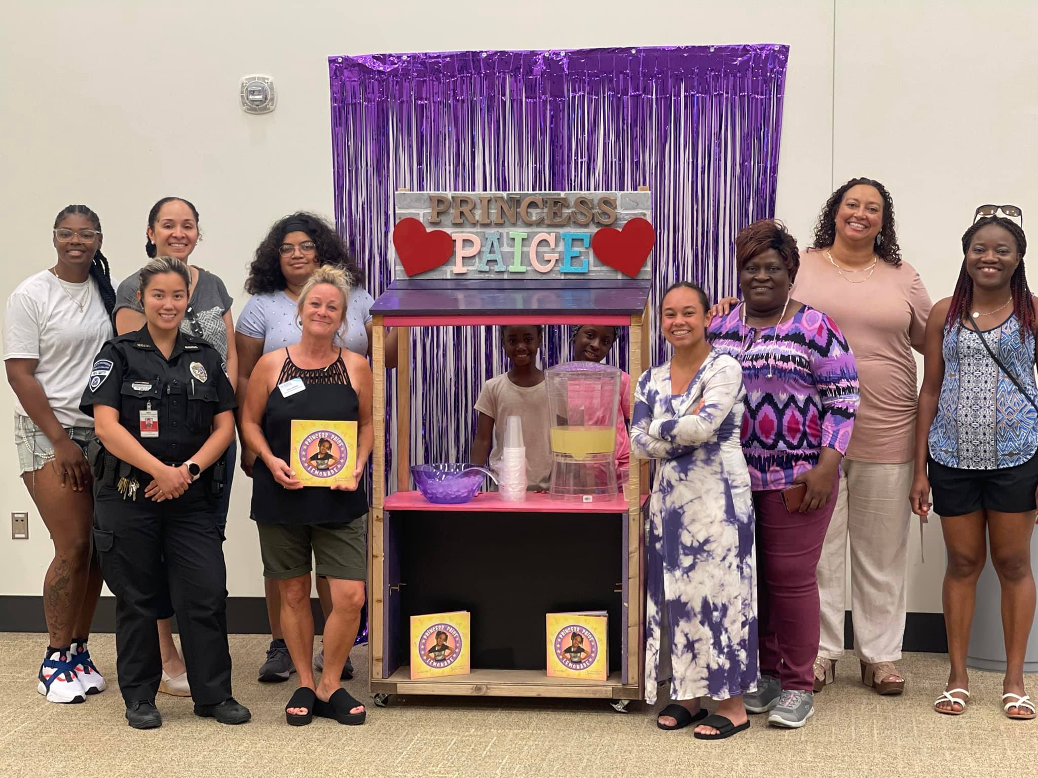 NHCC's Sista Hope 2 group with a local girl's lemonade business