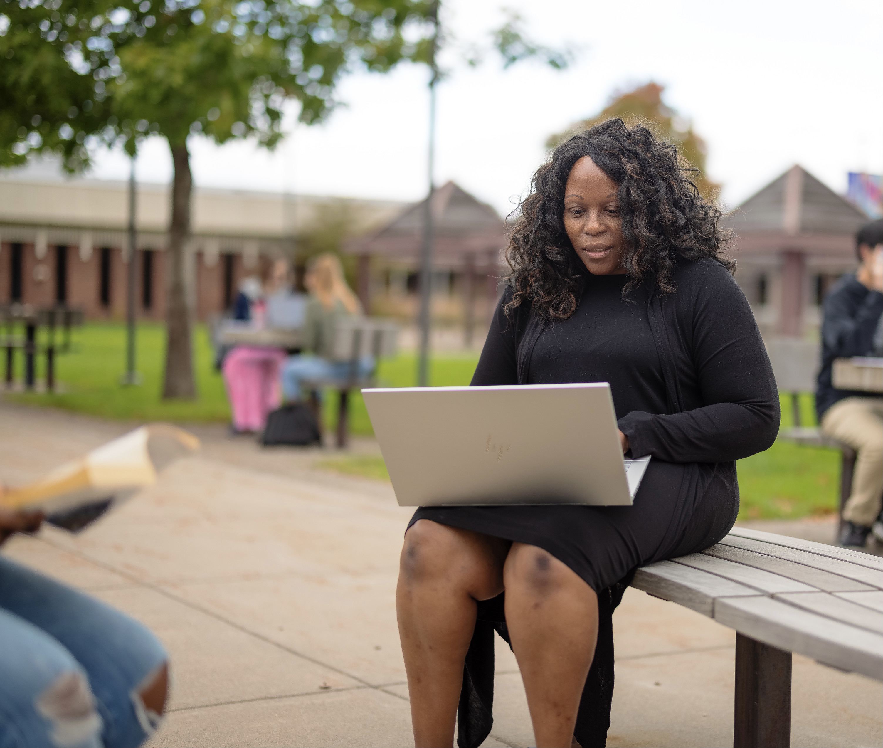 adult student fall 21 in courtyard