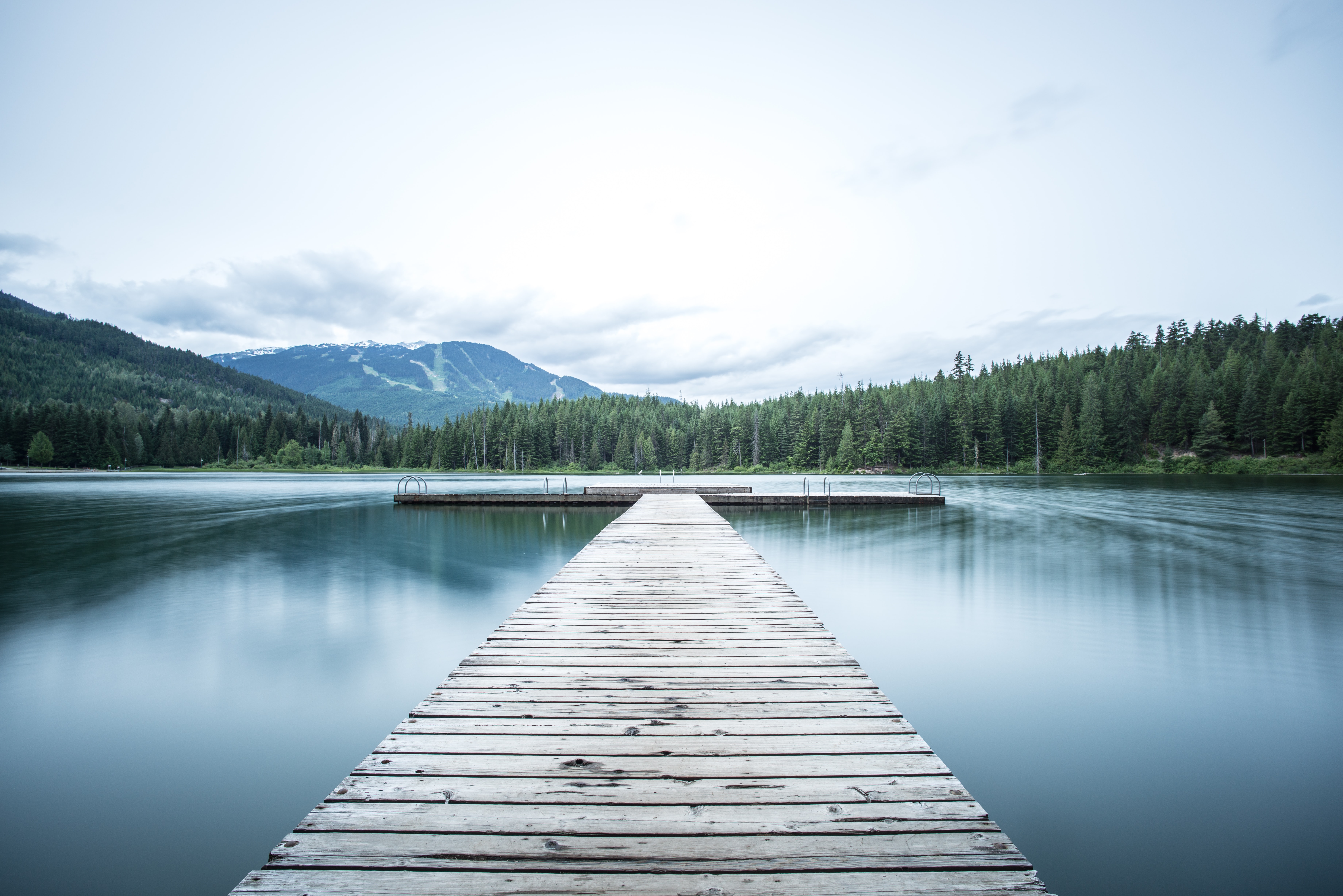 a photo of mountains and water symbolizing peace