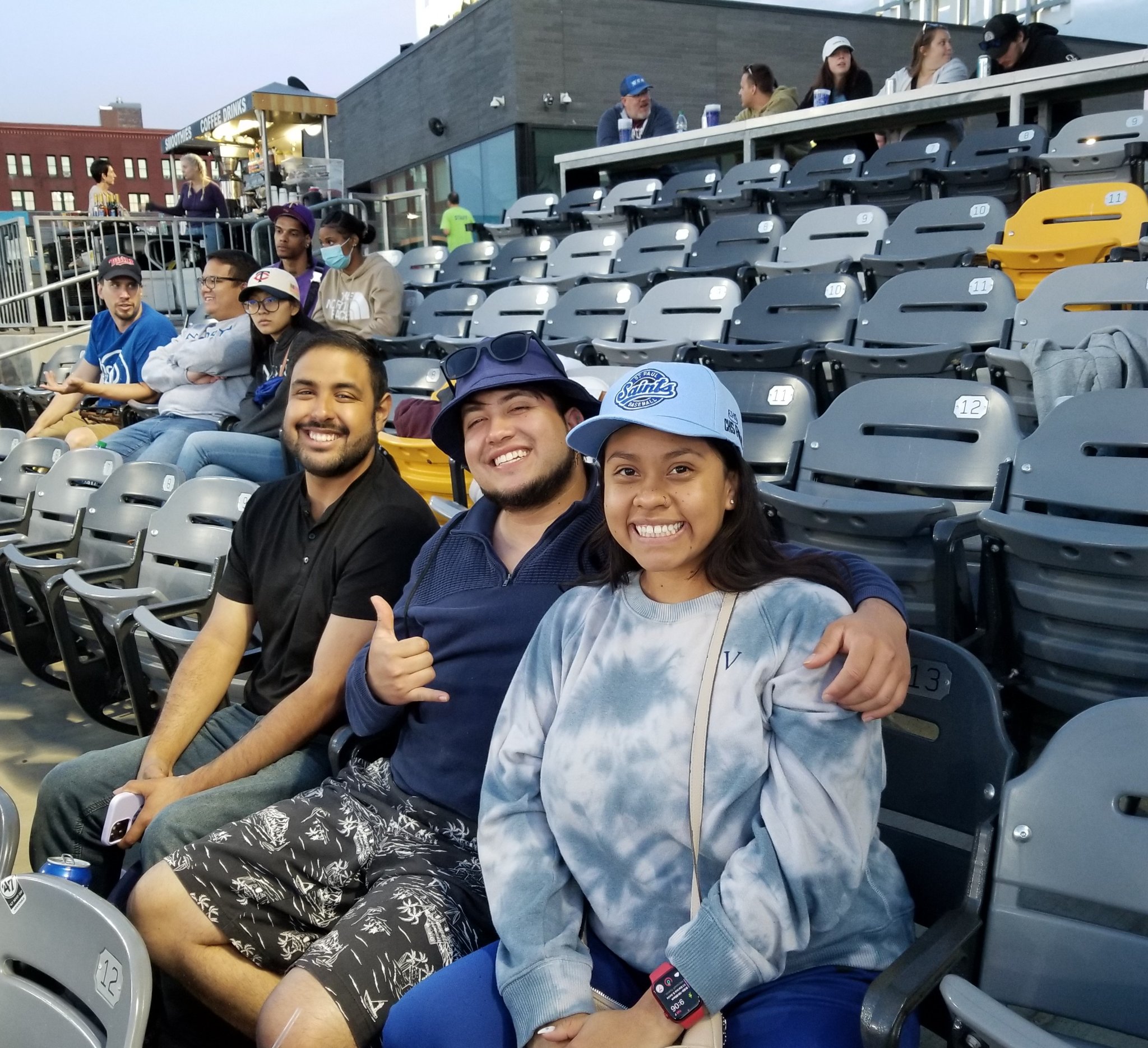 a group of NHCC alumni and friends at the Saints baseball game.