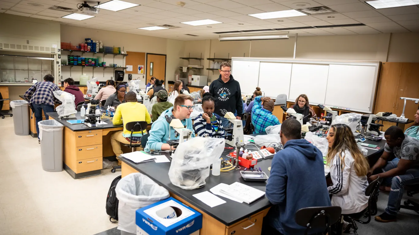 Students and instructors in biology lab 