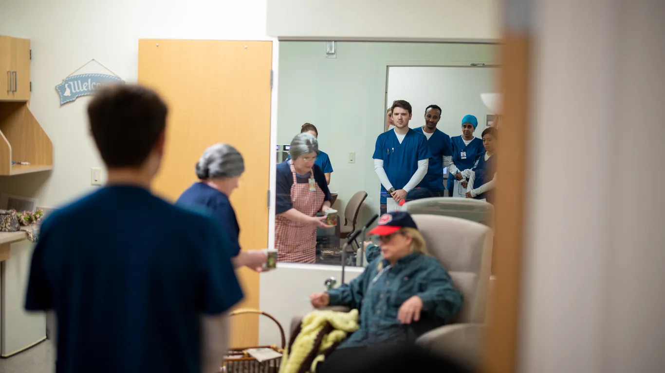 students in nursing lab with mirror in background