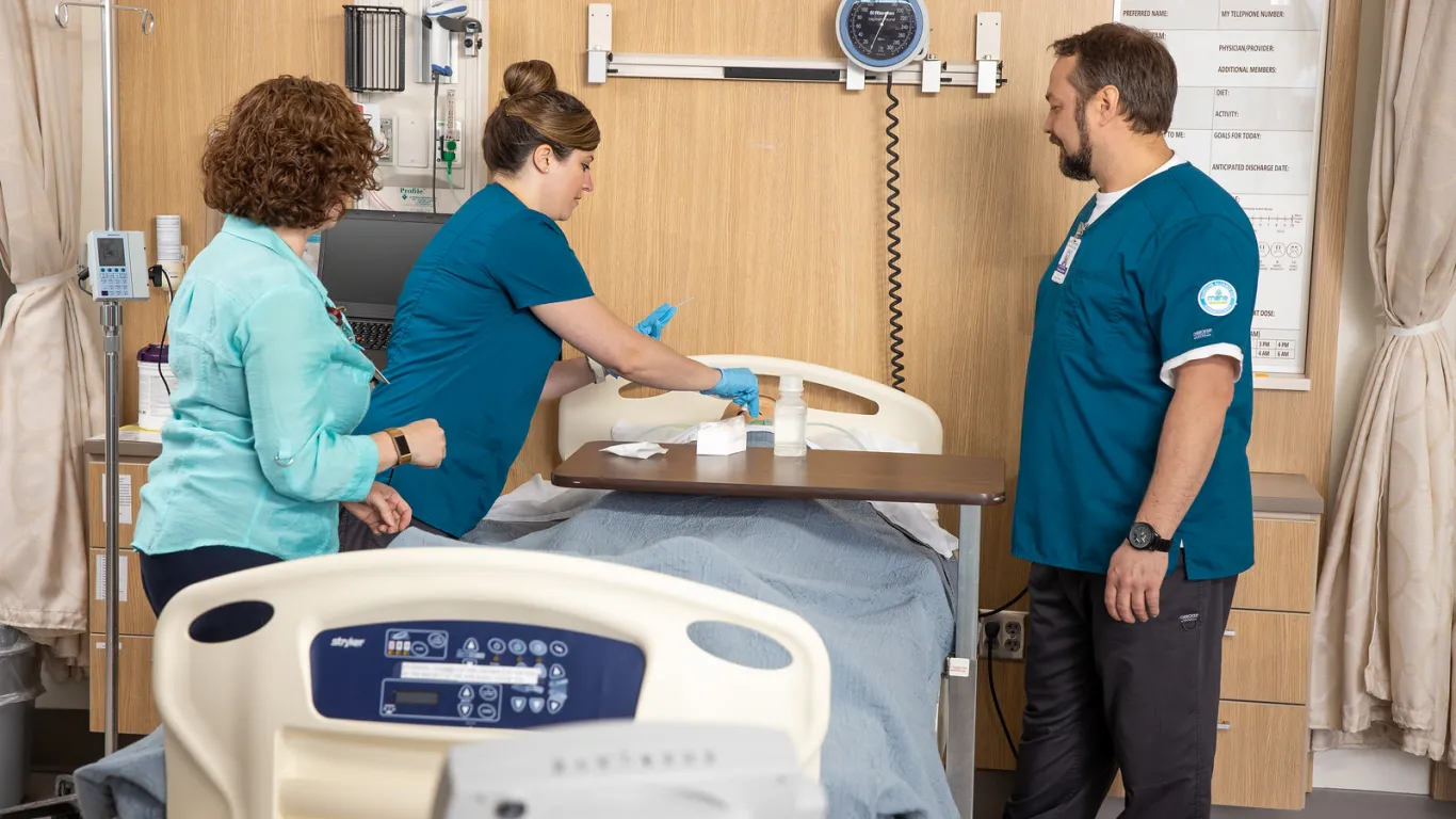 students and instructor in nursing lab