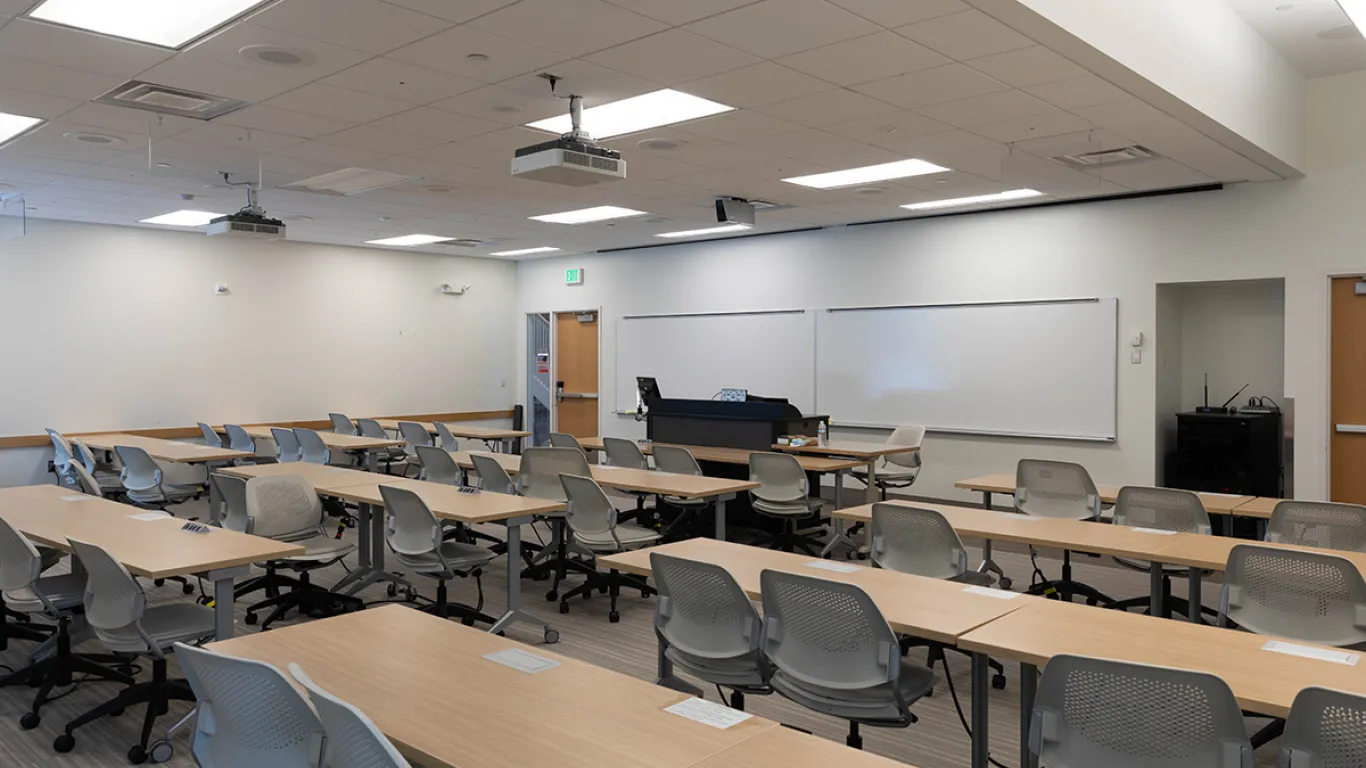 empty classroom with desks and chairs 