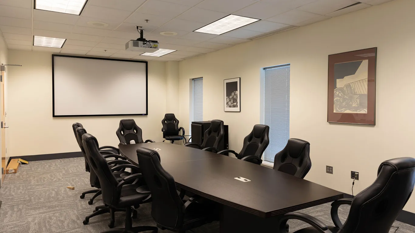 empty conference room with table and chairs 