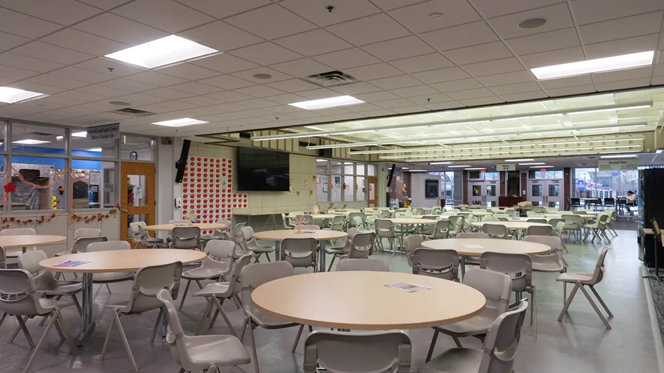 empty cafeteria with tables and chairs 