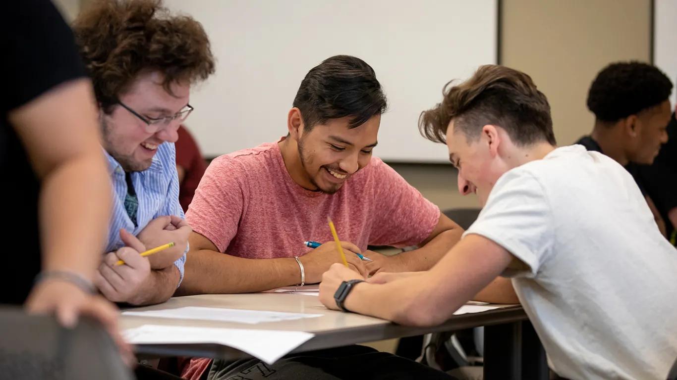 students talking at a table