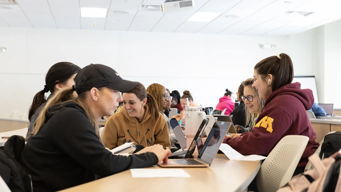 students working together with their laptops on the table 