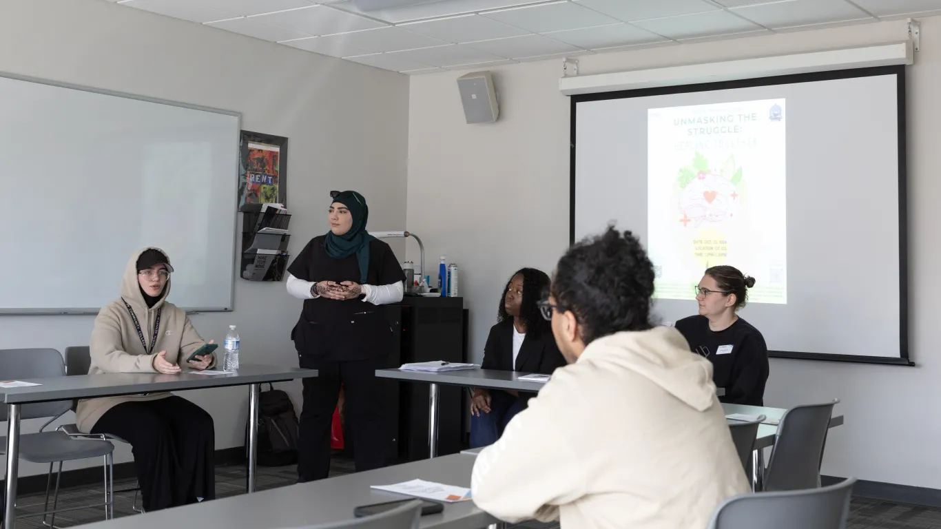 students talking in a classroom