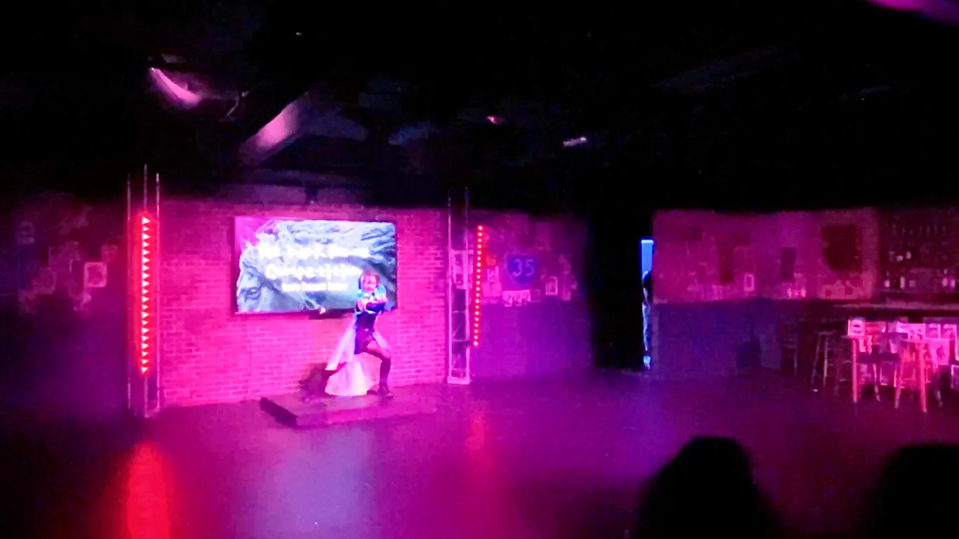 Actors performing on stage in the play “Airness”
