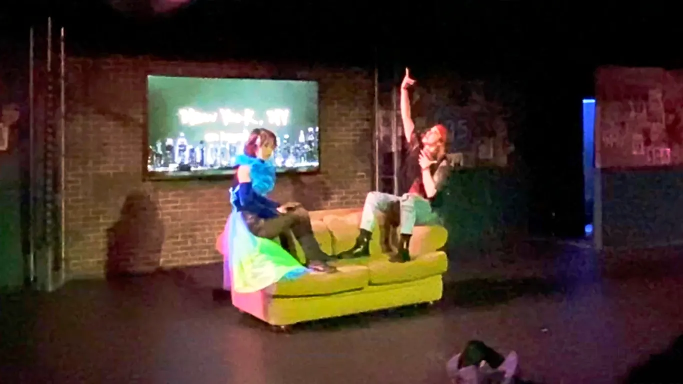Actors performing on stage in the play “Airness”