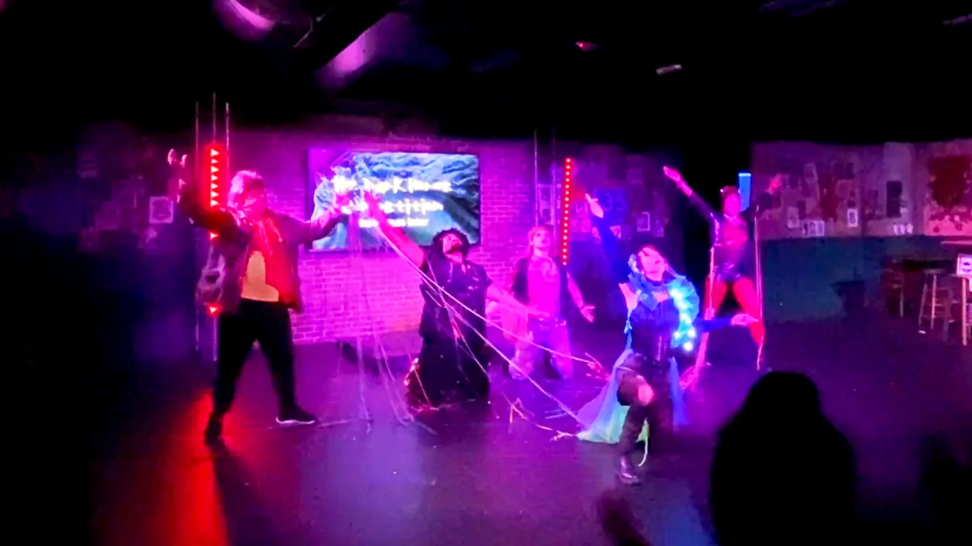 Actors performing on stage in the play “Airness”