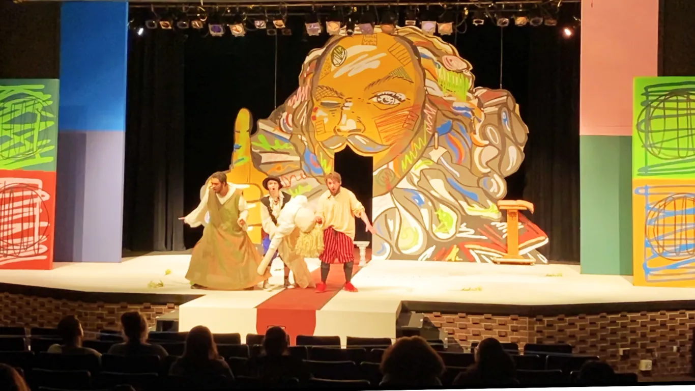 Actors performing on stage in the play “The Complete Works of William Shakespeare (abridged) [revised] [again]”