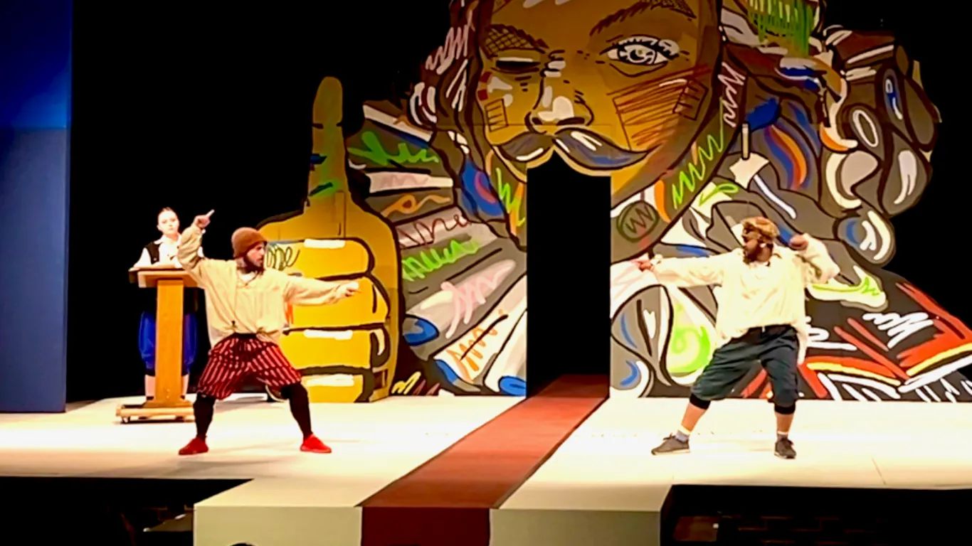 Actors performing on stage in the play “The Complete Works of William Shakespeare (abridged) [revised] [again]”