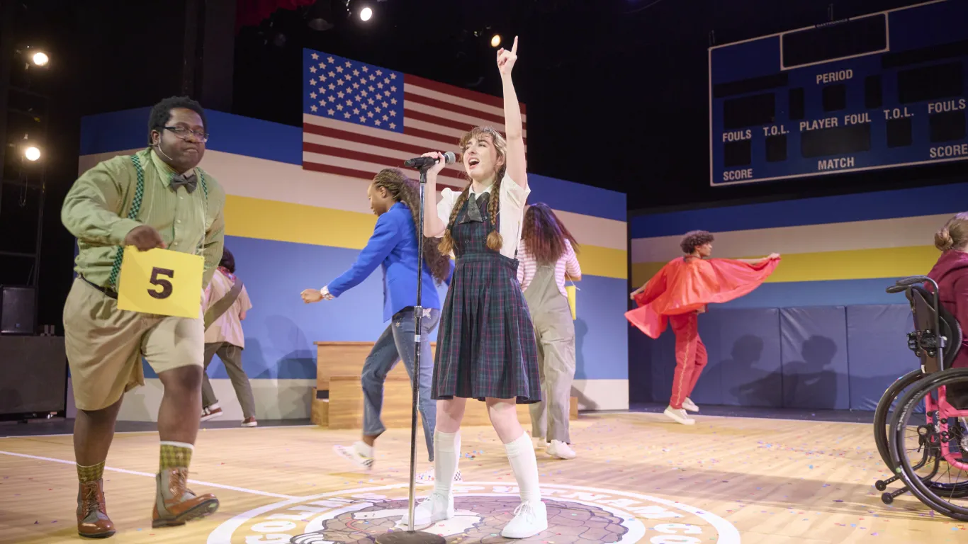 Actors on stage performing in the musical “The 25th Annual Putnam County Spelling Bee”