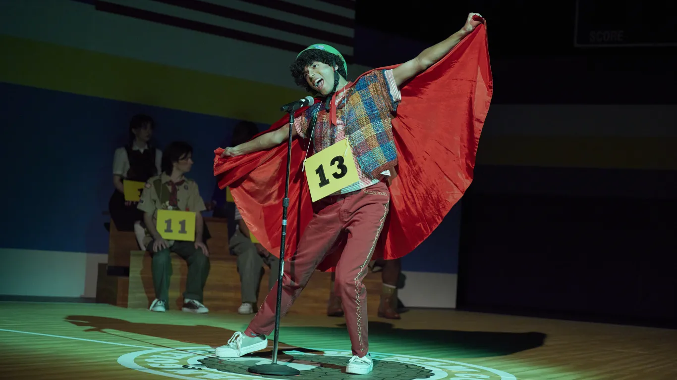 An actor performing on stage in a production of "The 25th Annual Putnam County Spelling Bee"