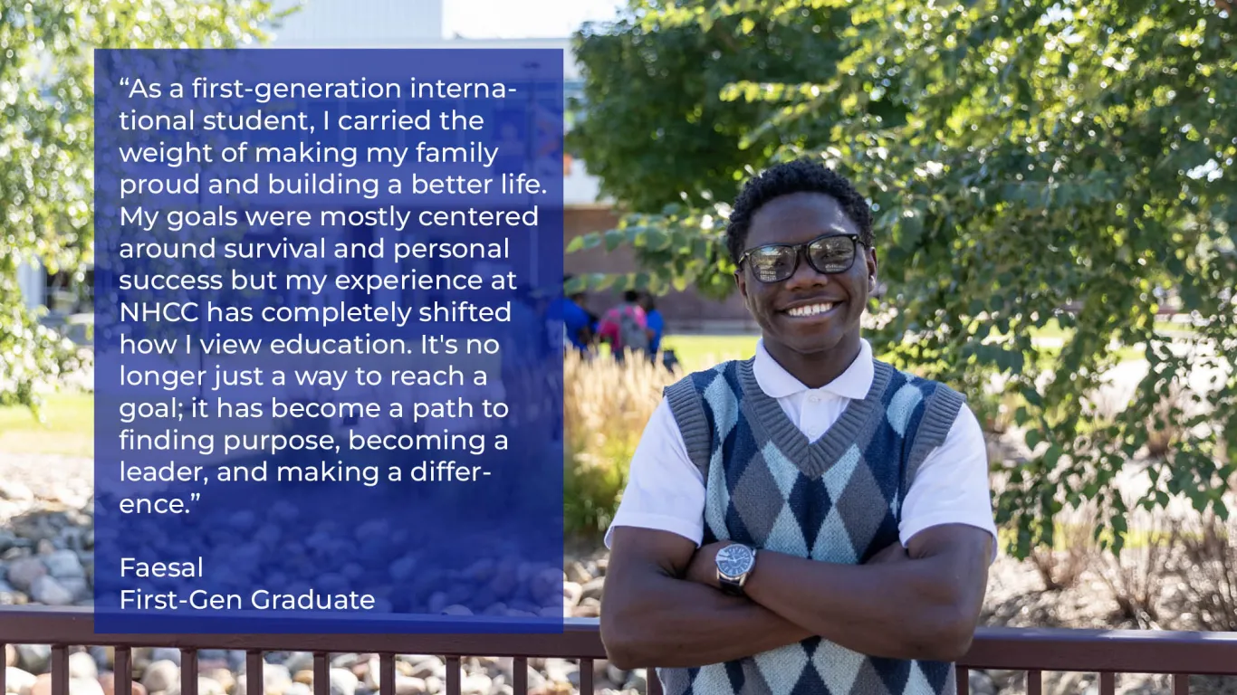 student with glasses standing outside smiling on a nice day