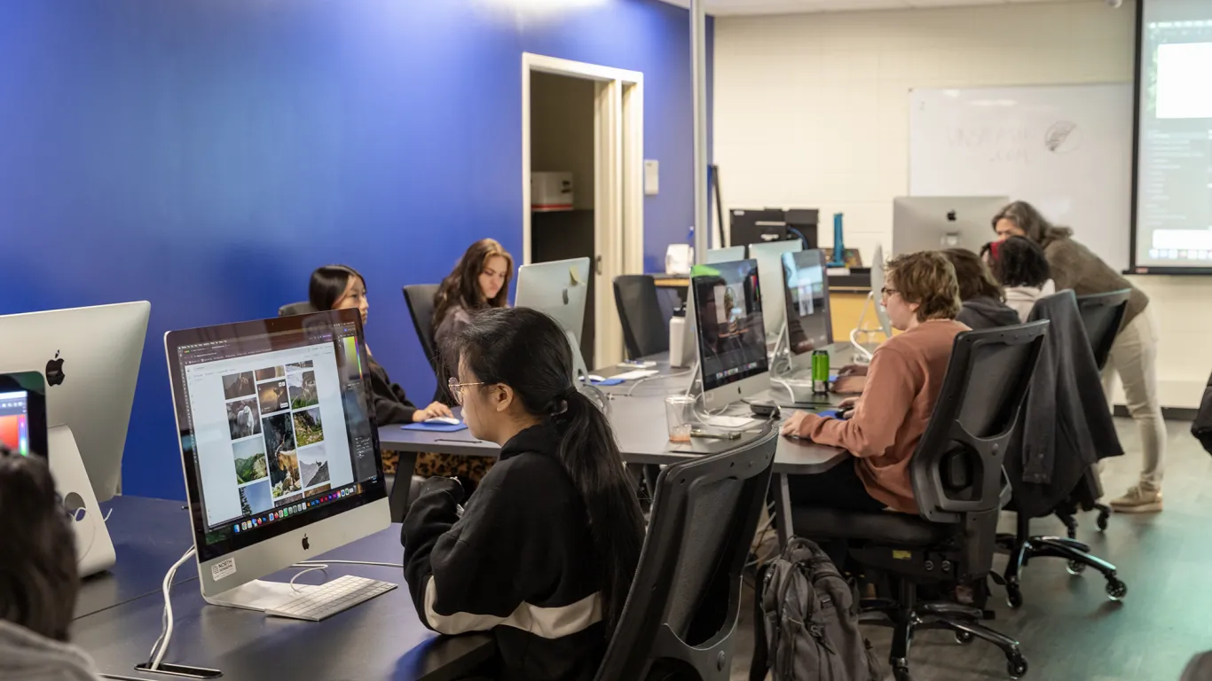 students at computers working on designs 