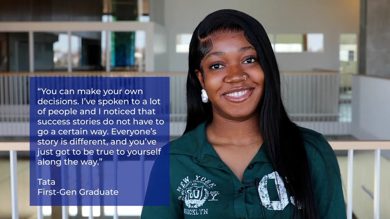 student smiling with a staircase in the background