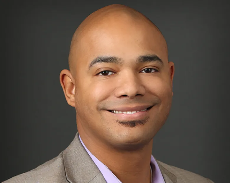 man smiling wearing a suit