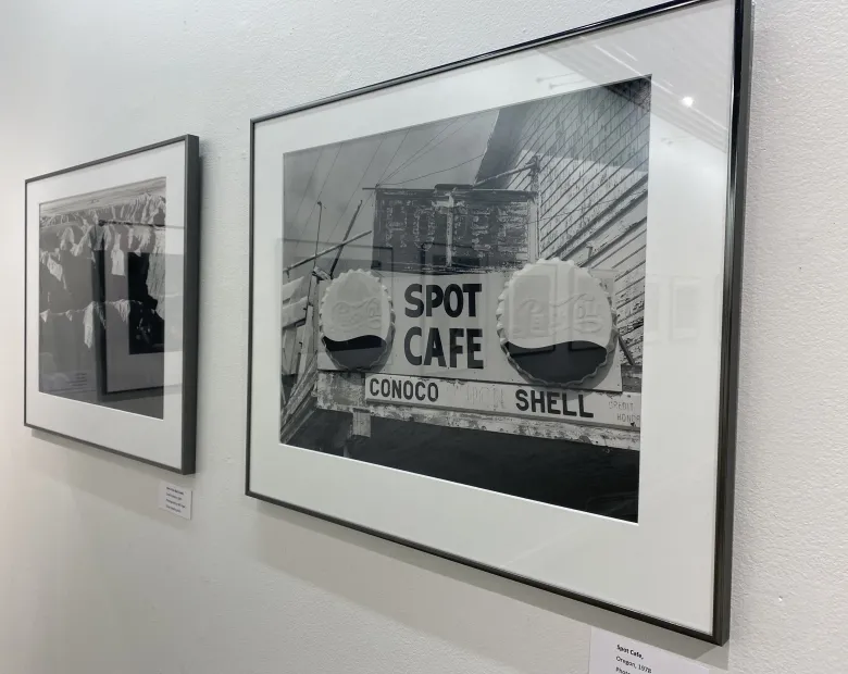 a black and white photo of a cafe sign 