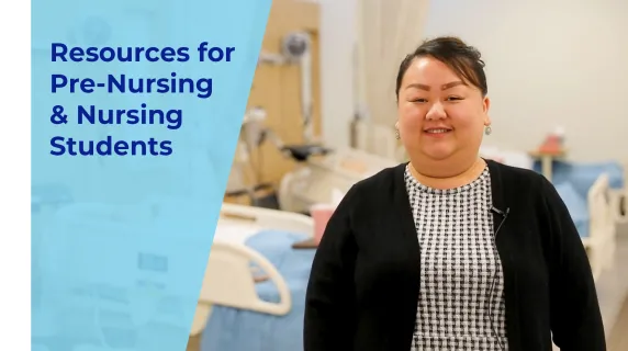 woman smiling standing in a nursing lab