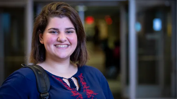 student smiling on NHCC campus