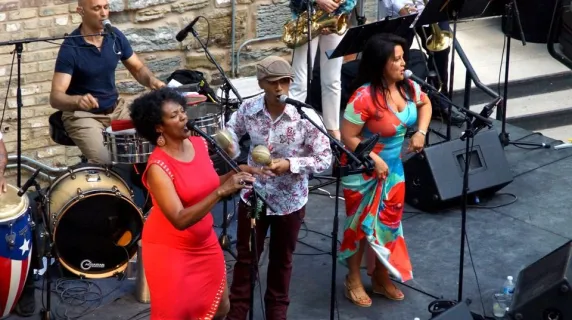 A salsa band performing on a stage