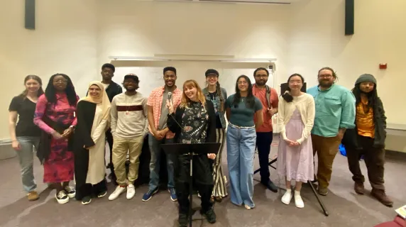 a group of students standing and smiling