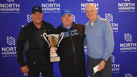 President Rolando Garcia with Team Alerus, the winners of the 2025 President's Cup Golf Classic with the trophy