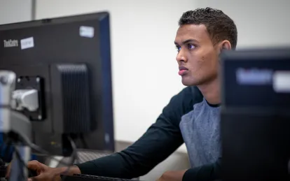 male student on a computer 