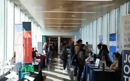 students talking with employers at a career fair