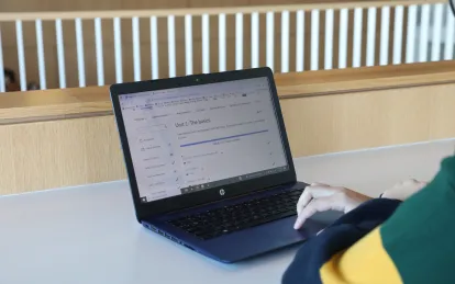 student looking at laptop