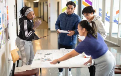 Students working around a table