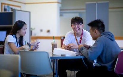 Students working around a table