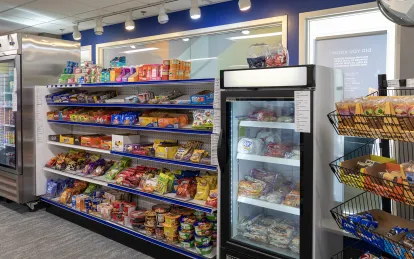 shelves with food and snacks and drinks in refrigerators 
