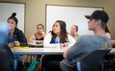 student sitting in a classroom 