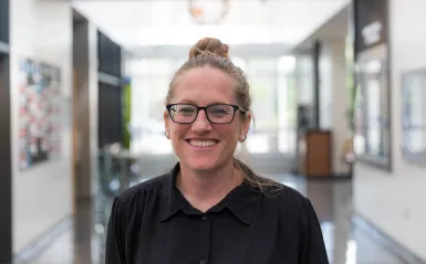 woman smiling wearing glasses