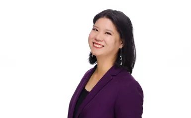 woman wearing purple smiling