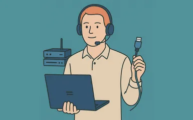 guy holding a laptop and a network cord 